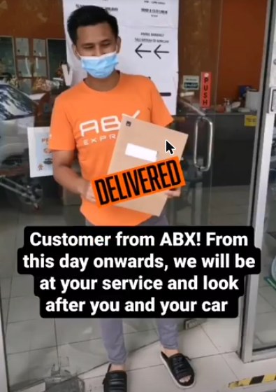 Atur serving a customer at ABX