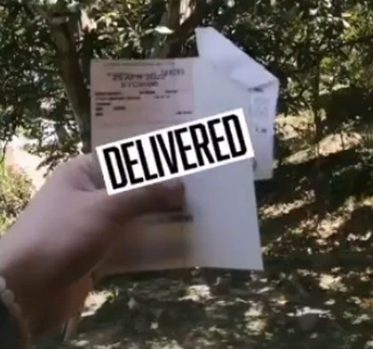 Roadtax delivered to a customer under a mango tree